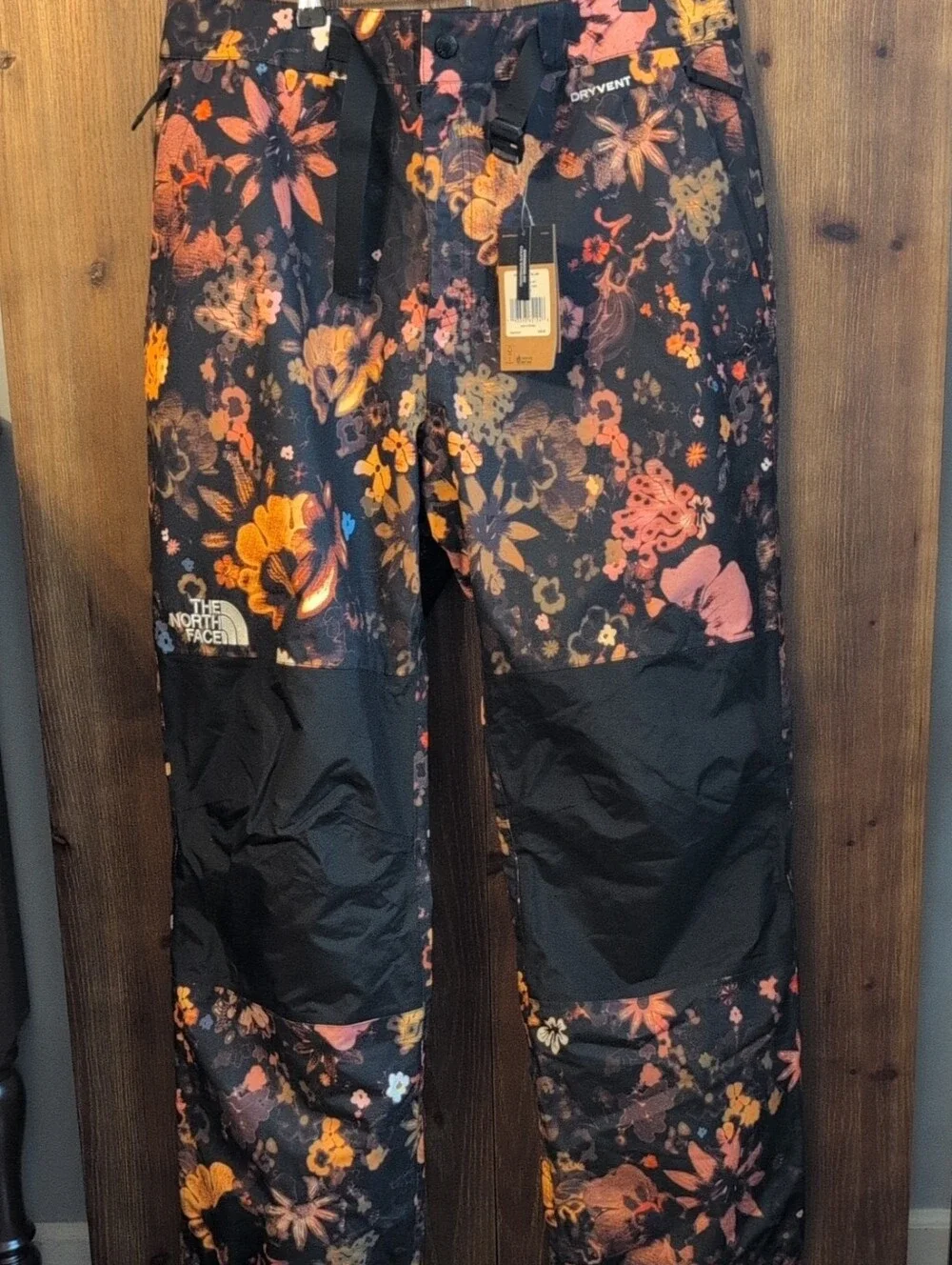 The North Face Black Floral Men's Snow Pants with Orange and Pink Accents